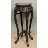 A late 19th century Chinese marble inset carved hardwood urn stand The beaded octagonal top inset