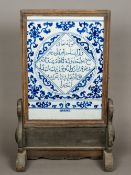 A Chinese blue and white porcelain mounted wooden table screen The porcelain panel centred with a