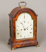 A George III mahogany twin fusee bracket clock The domed top with gilt brass loop handle,