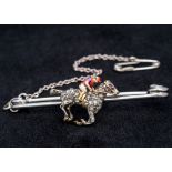 A unmarked gold diamond, ruby and enamel bar brooch Worked as a horse and jockey,