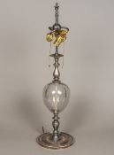 A silver plate mounted Murano glass table lamp The turned stem centred with an air bubble filled