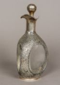 A Chinese silver mounted decanter The ball finial stopper engraved with ships above the shaped main