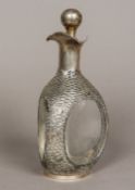 A Chinese silver mounted decanter