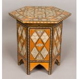 A North African inlaid coffee table The geometrically inlaid hinged hexagonal top enclosing the