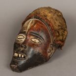 An African carved wooden tribal mask