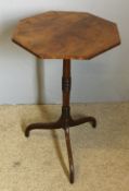 An early 19th century mahogany and oak tripod wine table The line inlaid crossbanded octagonal top