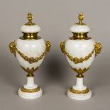 A pair of gilt bronze mounted white marb