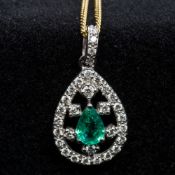 An 18 ct white gold diamond and emerald