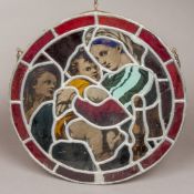 A lidded stained glass roundel depicting