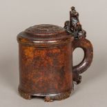 An 18th century Scandinavian treen burr birchwood peg tankard The domed lion carved lid with a