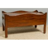 A 19th century Irish mahogany wine cooler The hinged crossbanded top enclosing the lead lined