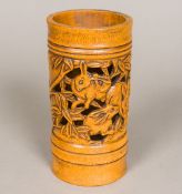 A Chinese pierced bamboo brush pot Of cylindrical form, carved with rabbits amongst foliage. 16.