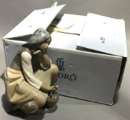 A large boxed Lladro matt figurine,