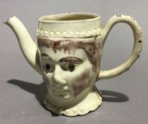 A Victorian Cream Ware double mask jug