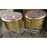 A pair of gilt marble top bedside drawers