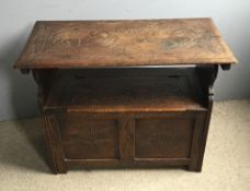 A Victorian carved oak monks bench