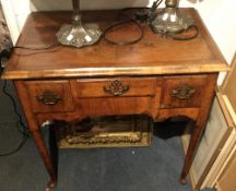 An 18th century walnut lowboy