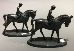 A pair of bronze horse and jockey groups