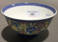 A small Chinese porcelain bowl decorated with flowers