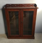 A Victorian walnut glazed bookcase