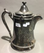 A large silver plated ceramic lined jug,