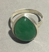 A silver and jade ring