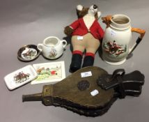 A small collection of hunting memorabilia and bellows