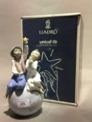 A boxed Lladro UNICEF figural group,