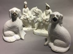A pair of Victorian Staffordshire figures and a pair of Victorian Staffordshire spaniels