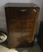 A vintage Art Deco walnut veneered cocktail cabinet