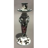 A Wemyss Ware chamber/candlestick, typically decorated,