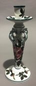 A Wemyss Ware chamber/candlestick, typically decorated,