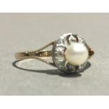 An 18 ct gold Edwardian diamond and pearl ring