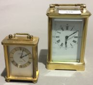 A carriage clock and a small desk clock