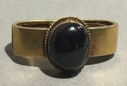 A garnet set unmarked gold tie clip (6 grammes total weight)