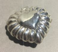 A silver heart pendant