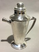 A silver plated cocktail jug