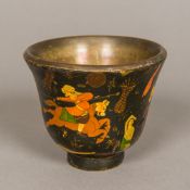 A 19th century Persian brass mounted papier mache cup, of flared tapering footed form,