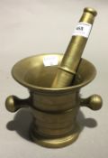 A brass pestle and mortar