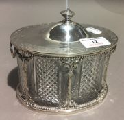 A silver plate mounted cut glass biscuit barrel