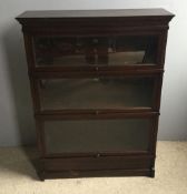 A three tier mahogany chapter stacking barristers bookcase