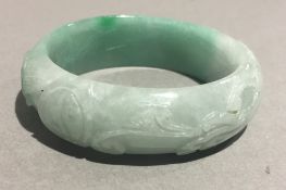 A Chinese carved jade bangle