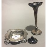 A silver dish and a silver bud vase