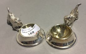 A pair of silver plated salts formed as dogs