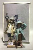 A boxed Lladro matt figural group,