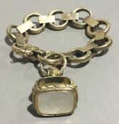 A 9 ct gold bracelet and a Victorian fob seal (45.