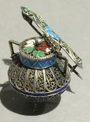 A Continental enamel decorated silver filigree brooch formed as a cooking pot and ladle