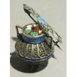 A Continental enamel decorated silver filigree brooch formed as a cooking pot and ladle