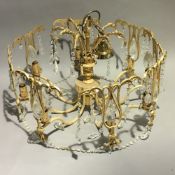 A brass and cut glass hanging light