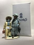 A boxed Lladro matt figural group,